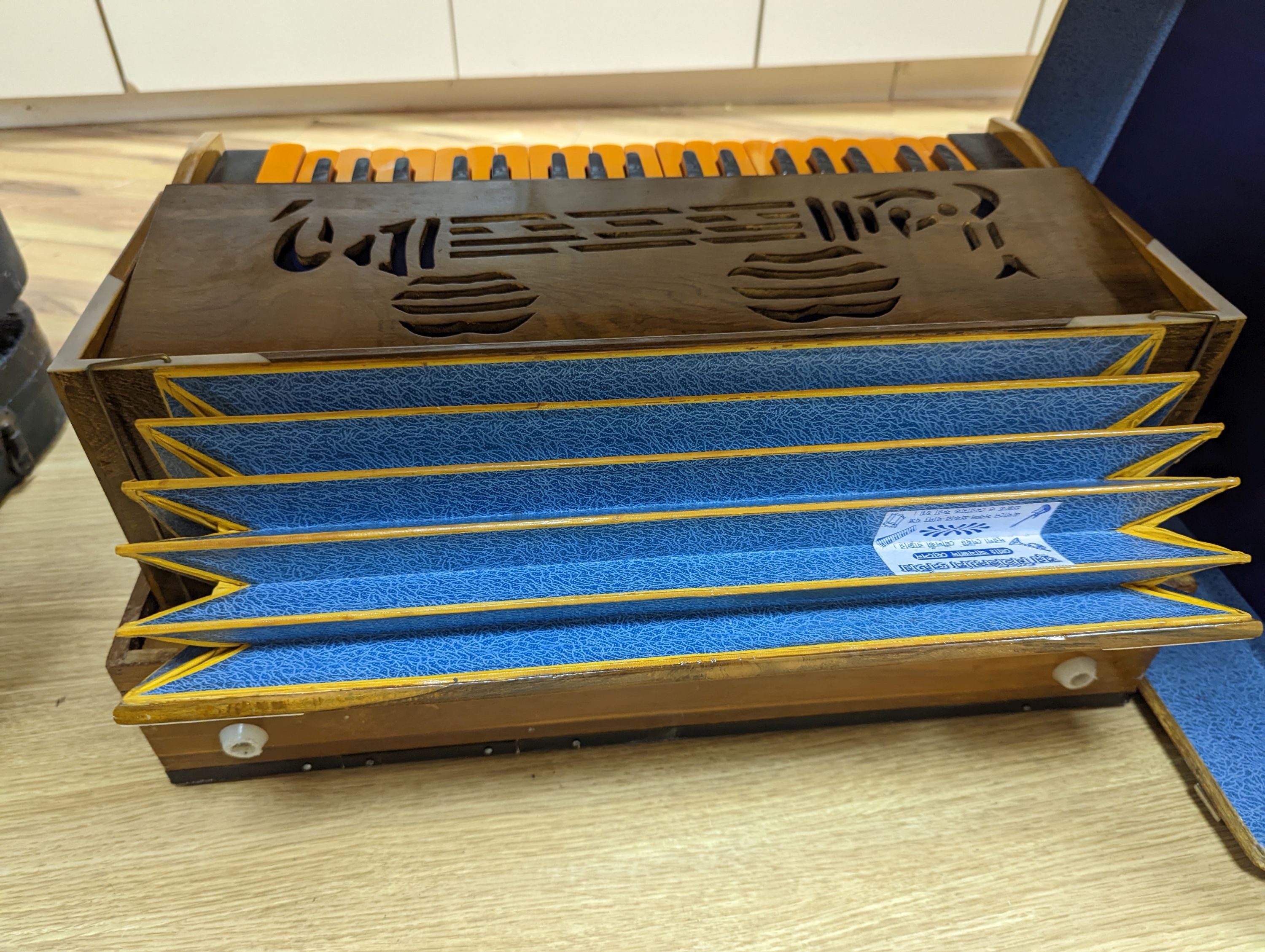 A hardwood cased harmonium